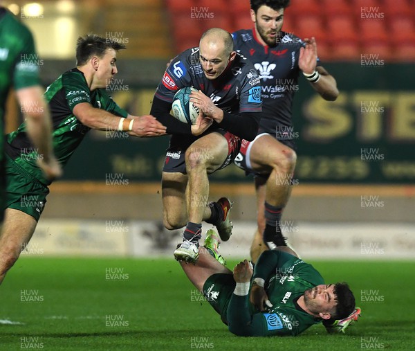 190222 - Scarlets v Connacht - United Rugby Championship - Ioan Nicholas of Scarlets is tackled by Sammy Arnold of Connacht