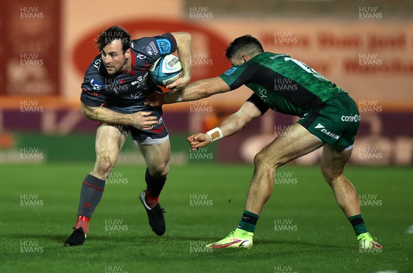 190222 - Scarlets v Connacht - United Rugby Championship - Ryan Conbeer of Scarlets is tackled by Tiernan O'Halloran of Connacht