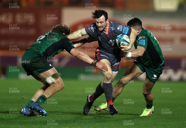 190222 - Scarlets v Connacht - United Rugby Championship - Ryan Conbeer of Scarlets is tackled by Tiernan O'Halloran and Cian Prendergast of Connacht