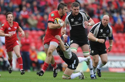 25.04.10 -  Scarlets v Connacht - Magners League - Josh Turnbull of Scarlets is tackled by Mike McComish of Connacht. 