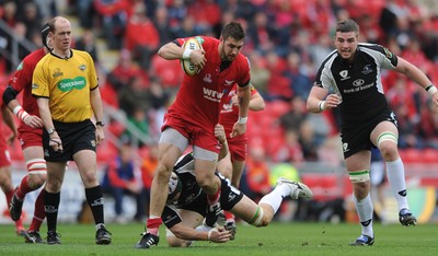 25.04.10 -  Scarlets v Connacht - Magners League - Josh Turnbull of Scarlets is tackled by Mike McComish of Connacht. 