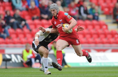 25.04.10 -  Scarlets v Connacht - Magners League - Jonathan Davies of Scarlets is tackled by Troy Nathan of Connacht 