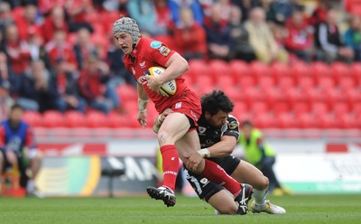 25.04.10 -  Scarlets v Connacht - Magners League - Jonathan Davies of Scarlets is tackled by Troy Nathan of Connacht 