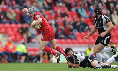 25.04.10 -  Scarlets v Connacht - Magners League - Jonathan Davies of Scarlets is tackled by Troy Nathan of Connacht 