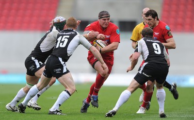 25.04.10 -  Scarlets v Connacht - Magners League - Rhys Thomas of Scarlets takes on Liam Bibo(15) of Connacht. 