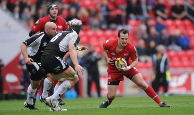 25.04.10 -  Scarlets v Connacht - Magners League - Daniel Evans of Scarlets looks for a way past Mike McComish of Connacht. 