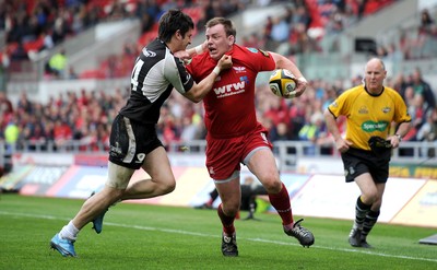 25.04.10 -  Scarlets v Connacht - Magners League - Matthew Rees of Scarlets is tackled by Tiernan O'Halloran of Connacht. 