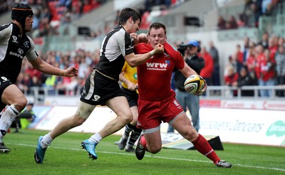 25.04.10 -  Scarlets v Connacht - Magners League - Matthew Rees of Scarlets is tackled by Tiernan O'Halloran of Connacht. 