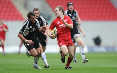 25.04.10 -  Scarlets v Connacht - Magners League - Lee Williams of Scarlets tries to get away from the Connacht defence. 