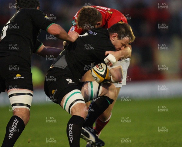 28.09.07 - Llanelli Scarlets v Connacht, Magners League - Connachts Colin Rigney is held by Scarlets Dafydd Jones 