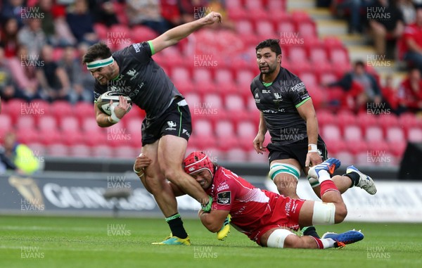 280919 - Scarlets v Connacht - Guinness PRO14 - Tom Daly of Connacht is tackled by Josh Macleod of Scarlets