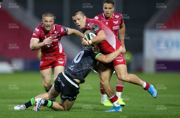280919 - Scarlets v Connacht - Guinness PRO14 - Steff Evans of Scarlets is tackled by Conor Fitzgerald of Connacht
