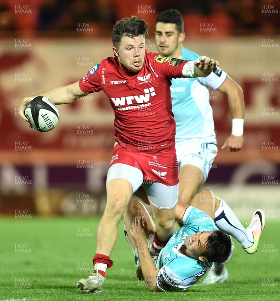 290917 - Scarlets v Connacht - Guinness PRO14 - Steff Evans of Scarlets is tackled by Tiernan O'Halloran of Connacht