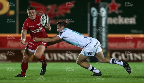 290917 - Scarlets v Connacht - Guinness PRO14 - Scott Williams of Scarlets is tackled by Jack Carty of Connacht