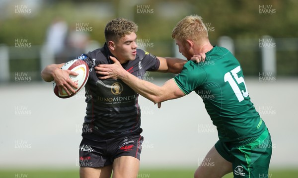 290918 - Scarlets A v Connacht Eagles, Celtic Cup, Carmarthen - Corey Baldwin of Scarlets holds off Darragh Leader of Connacht Eagles to set up try for Morgan Williams of Scarlets