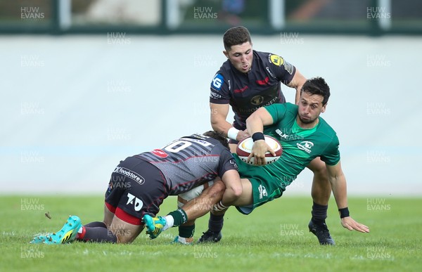 290918 - Scarlets A v Connacht Eagles, Celtic Cup, Carmarthen - James Mitchell of Connacht Eagles is tackled by Dan Jones of Scarlets and Declan Smith of Scarlets