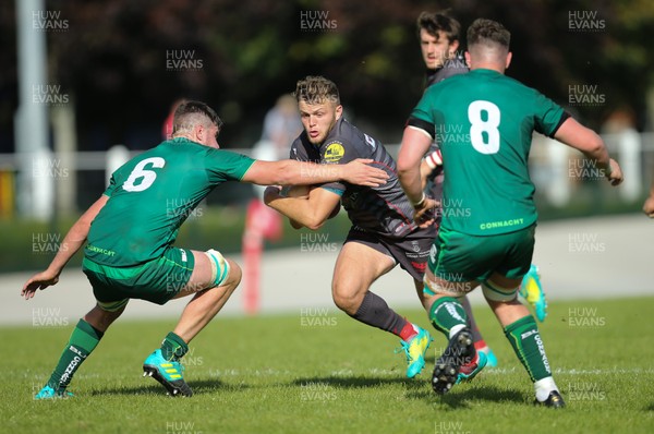 290918 - Scarlets A v Connacht Eagles, Celtic Cup, Carmarthen - Steff Hughes of Scarlets is tackled by Mikey Wilson of Connacht Eagles and Neal Moylett of Connacht Eagles
