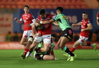 101025 - Scarlets v DHL Stormers - United Rugby Championship - Johnny Williams of Scarlets is tackled by Sacha Feinberg-Mngomezulu of Stormers 