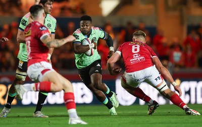 101025 - Scarlets v DHL Stormers, United Rugby Championship - Wandisile Simelane of Stormers takes on Taine Plumtree of Scarlets