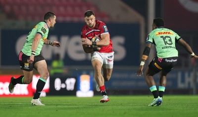 101025 - Scarlets v DHL Stormers, United Rugby Championship -Johnny Williams of Scarlets takes on Ruhan Nel of Stormers and Wandisile Simelane of Stormers