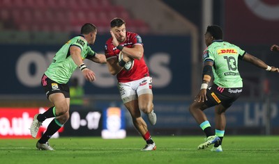 101025 - Scarlets v DHL Stormers, United Rugby Championship -Johnny Williams of Scarlets takes on Ruhan Nel of Stormers and Wandisile Simelane of Stormers