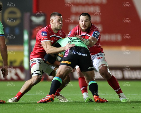 101025 - Scarlets v DHL Stormers - United Rugby Championship - Jarrod Taylor and Marnus van der Merwe of Scarlets tackle JJ Kotze of Stormers 