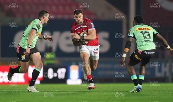 101025 - Scarlets v DHL Stormers, United Rugby Championship -Johnny Williams of Scarlets takes on Ruhan Nel of Stormers and Wandisile Simelane of Stormers