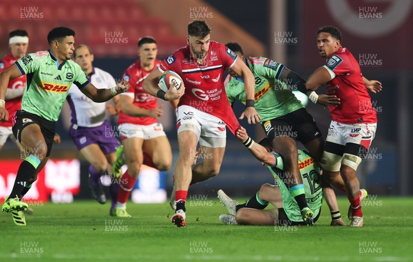 101025 - Scarlets v DHL Stormers, United Rugby Championship -Johnny Williams of Scarlets takes on Ruhan Nel of Stormers and Wandisile Simelane of Stormers