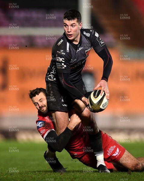 010121 - Scarlets v Dragons - Guinness PRO14 - Owen Jenkins of Dragons is tackled by Paul Asquith of Scarlets