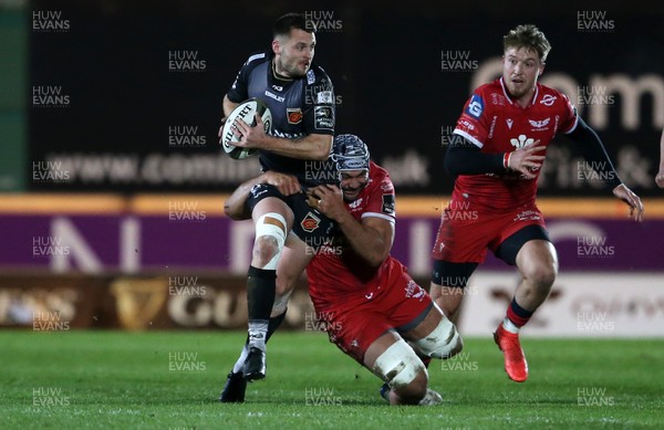010121 - Scarlets v Dragons - Guinness PRO14 - Josh Lewis of Dragons is tackled by Sione Kalamafoni of Scarlets