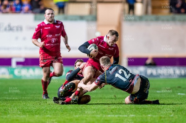 050119 - Scarlets v Dragons - Guinness PRO14 - Ioan Nicholas of Scarlets is tackled by Jack Dixon of Dragons 