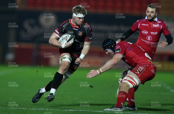 050119 - Scarlets v Dragons - Guinness PRO14 - Aaron Wainwright of Dragons is tackled by Ed Kennedy of Scarlets