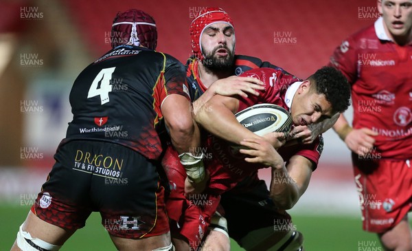050119 - Scarlets v Dragons - Guinness PRO14 - Dan Davis of Scarlets is tackled by Brandon Nansen and Cory Hill of Dragons