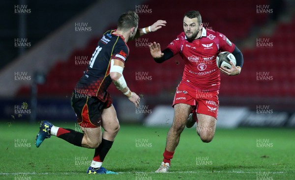 050119 - Scarlets v Dragons - Guinness PRO14 - Paul Asquith of Scarlets is tackled by Hallam Amos of Dragons