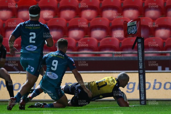 061023 - Scarlets v Dragons RFC - Preseason Friendly - Jared Rosser of Dragons scores a try