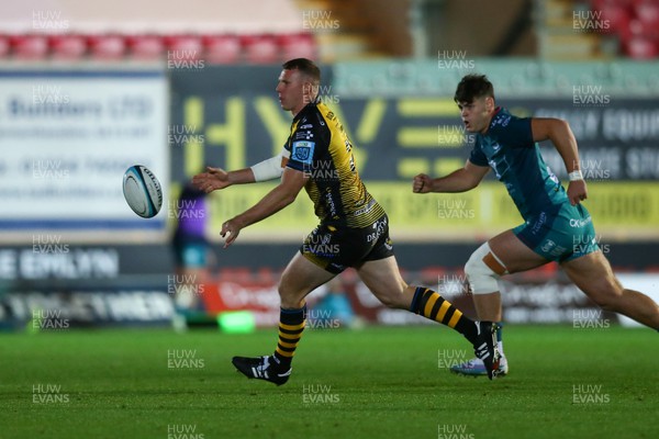 061023 - Scarlets v Dragons RFC - Preseason Friendly - Jack Dixon of Dragons passes the ball