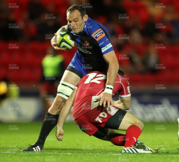 081113  - Scarlets v Newport Gwent Dragons - LV= Cup -  Rob Sidoli of Newport Gwent Dragons is tackled by Adam Warren of Scarlets