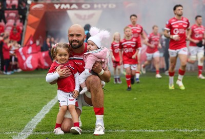 160526 - Scarlets v Dragons RFC, United Rugby Championship - Josh Macleod of Scarlets walked out with his family on his 150th cap