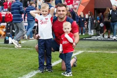 160526 - Scarlets v Dragons RFC - United Rugby Championship - Scarlets coach Emyr Phillips with his children at the end of the match