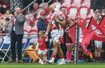 160526 - Scarlets v Dragons RFC - United Rugby Championship - Josh Macleod of Scarlets brings his children onto the pitch as he makes his 150th appearance for the Scarlets