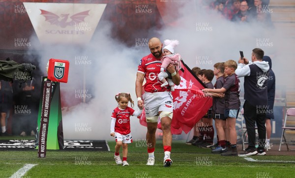 160526 - Scarlets v Dragons RFC, United Rugby Championship - Josh Macleod of Scarlets walked out with his family on his 150th cap