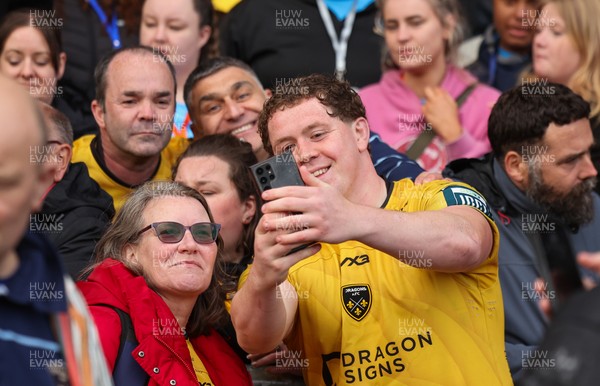 160526 - Scarlets v Dragons RFC, United Rugby Championship - Brodie Coghlan of Dragons poses for a selfie with fans