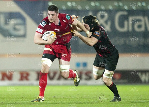 010313 - Scarlets v Edinburgh - RaboDirect PRO12 -Rob McCusker of Scarlets, left, is tackled by Edinburgh's Hamish Watson