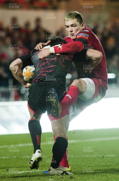 010313 - Scarlets v Edinburgh - RaboDirect PRO12 -Gareth Maule of Scarlets tackles Lee Jones of Edinburgh 