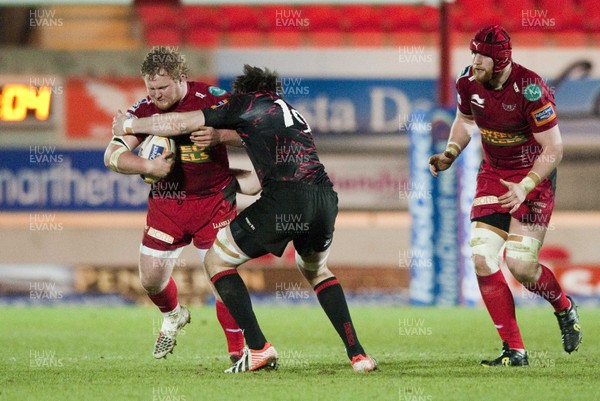 010313 - Scarlets v Edinburgh - RaboDirect PRO12 -Samson Lee of Scarlets is tackled by Rob McAlpine of Edinburgh 