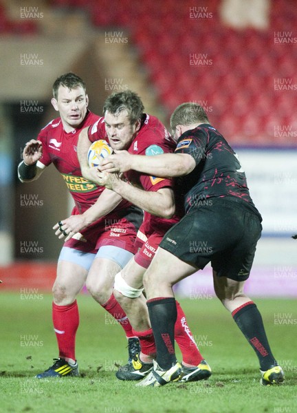 010313 - Scarlets v Edinburgh - RaboDirect PRO12 -Joe Synman of Scarlets, is tackled by Edinburgh's Willem Nel