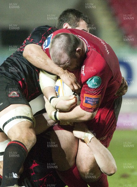 010313 - Scarlets v Edinburgh - RaboDirect PRO12 -Phil John of Scarlets is wrapped up by the Edinburgh defence 