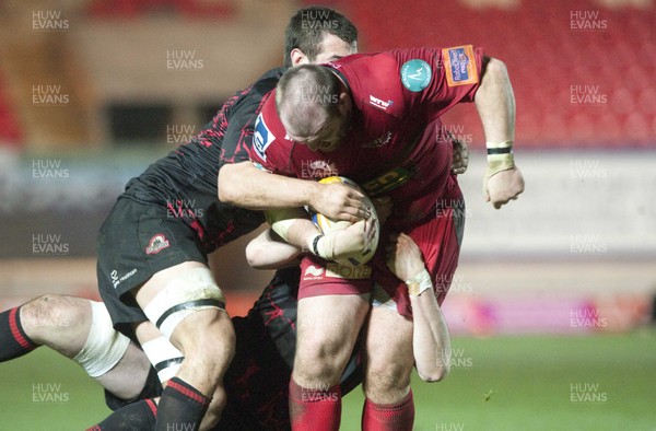 010313 - Scarlets v Edinburgh - RaboDirect PRO12 -Phil John of Scarlets is wrapped up by the Edinburgh defence 