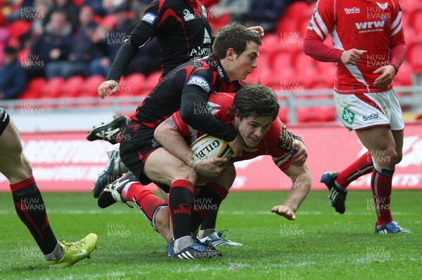 08.03.09 - Scarlets v Edinburgh, Magners League. -  Scarlets' Gavin Evans is tackled by Edinburgh's Greig Laidlaw   