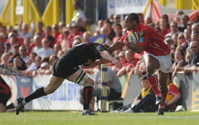 10.05.08 - Magners League Rugby Llanelli Scarlets v Edinburgh Scarlets' Nathan Brew tries to get past Edinburgh's Ben Cairns 